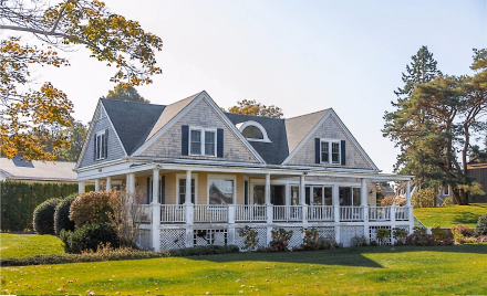 Residential exterior before repainting, showing substrate and prep needs.