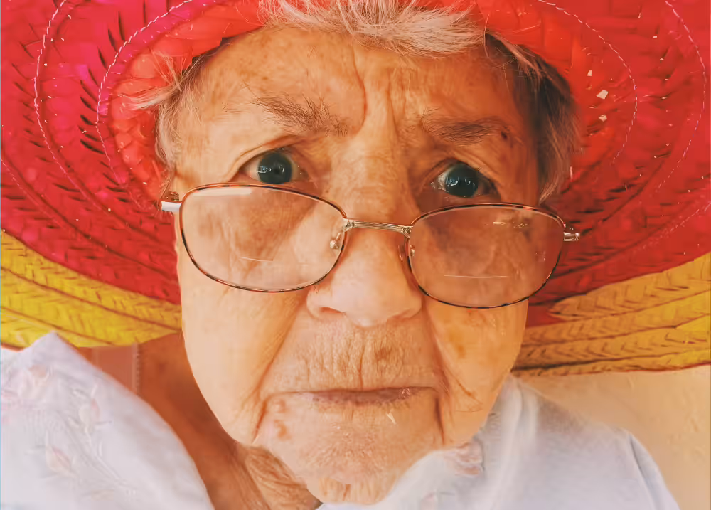 old lady with colorful hat